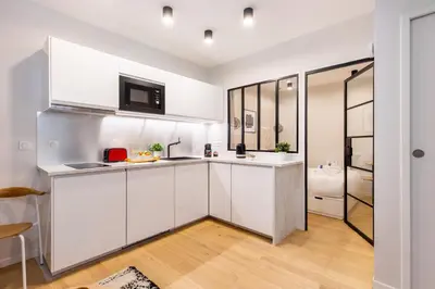 Cuisine ou kitchenette dans l'établissement Charming apartment - 2BR-6P - Grands Boulevards