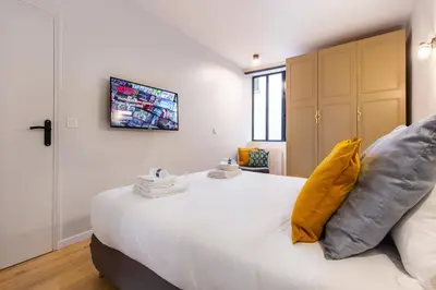 Un ou plusieurs lits dans un hébergement de l'établissement Charming apartment - 2BR-6P - Grands Boulevards