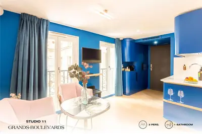 Télévision ou salle de divertissement dans l'établissement Beauquartier - Grands Boulevards
