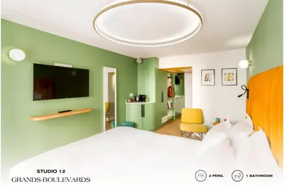 Télévision ou salle de divertissement dans l'établissement Beauquartier - Grands Boulevards