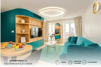 Télévision ou salle de divertissement dans l'établissement Beauquartier - Grands Boulevards