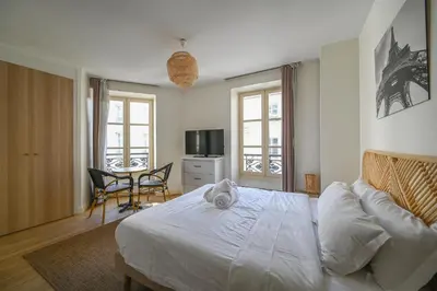Un ou plusieurs lits dans un hébergement de l'établissement Lovely parisien apartment (opera 3)