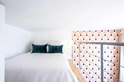 Un ou plusieurs lits dans un hébergement de l'établissement HolidaysInParis - Bonne Nouvelle