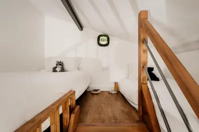 Un ou plusieurs lits dans un hébergement de l'établissement Edgar Suites Martyrs - Loft