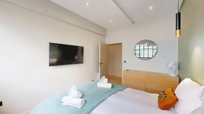 Un ou plusieurs lits dans un hébergement de l'établissement 178 Suite Cesar - Superb apartment in Paris