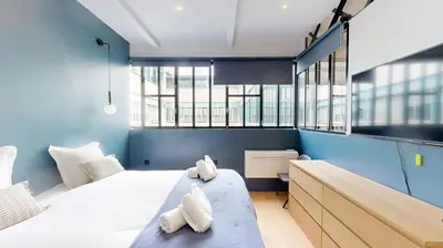 Un ou plusieurs lits dans un hébergement de l'établissement 178 Suite Cesar - Superb apartment in Paris