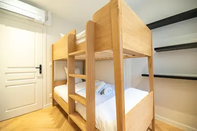 Un ou plusieurs lits dans un hébergement de l'établissement Luxury apartments in Paris Center