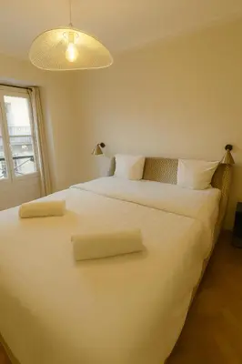 Un ou plusieurs lits dans un hébergement de l'établissement Luxury apartments in Paris Center