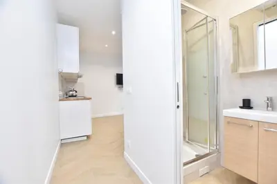 Cuisine ou kitchenette dans l'établissement Résidence 1BDR Bastille