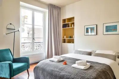 Un ou plusieurs lits dans un hébergement de l'établissement The Perfect Parisian Flat Bd St-Germain - Mid Term