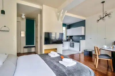 Un ou plusieurs lits dans un hébergement de l'établissement The Perfect Parisian Flat Bd St-Germain - Mid Term