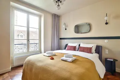 Un ou plusieurs lits dans un hébergement de l'établissement The Perfect Parisian Flat Bd St-Germain - Mid Term