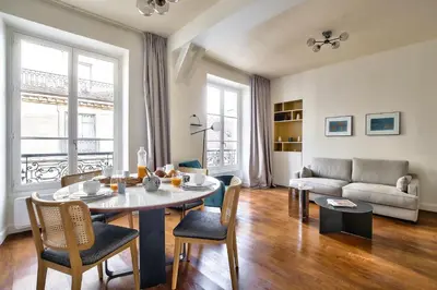 Coin salon dans l'établissement The Perfect Parisian Flat Bd St-Germain - Mid Term