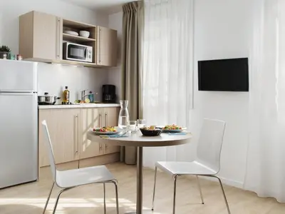 Cuisine ou kitchenette dans l'établissement Aparthotel Adagio Access Paris Clichy