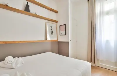 Un ou plusieurs lits dans un hébergement de l'établissement GuestReady - Modern flat near Latin Quarter!