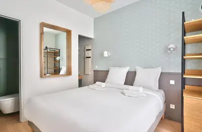 Un ou plusieurs lits dans un hébergement de l'établissement GuestReady - Modern flat near Latin Quarter!