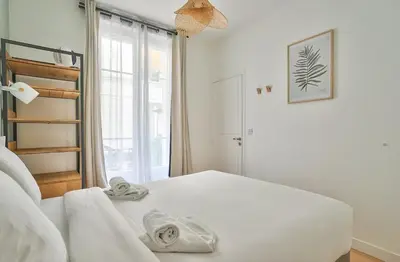 Un ou plusieurs lits dans un hébergement de l'établissement GuestReady - Modern flat near Latin Quarter!