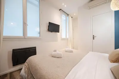 Un ou plusieurs lits dans un hébergement de l'établissement Lovely Home in Paris Center - AC