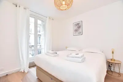 Un ou plusieurs lits dans un hébergement de l'établissement Superb apartment - 6P- Center of Paris