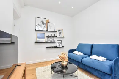 Coin salon dans l'établissement Welcoming apartment - 1BR-4P -Grands Boulevards