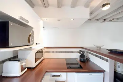 Cuisine ou kitchenette dans l'établissement Habitat Parisien - Marais Sicile