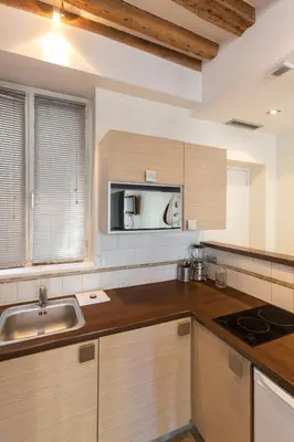 Cuisine ou kitchenette dans l'établissement Habitat Parisien - Marais Sicile