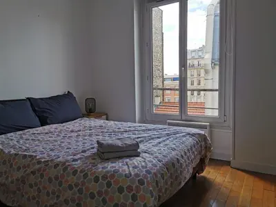 Un ou plusieurs lits dans un hébergement de l'établissement Lovely Flat in Paris - City center - Nation-Picpus