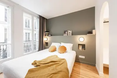 Un ou plusieurs lits dans un hébergement de l'établissement Central and renovated Parisian apartment, 6-7 guests