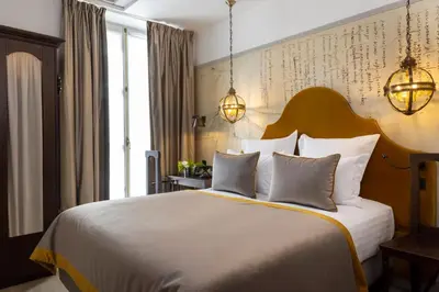 Un ou plusieurs lits dans un hébergement de l'établissement Hôtel & Spa Vinci Due