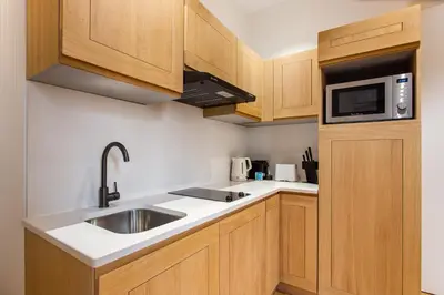 Cuisine ou kitchenette dans l'établissement CMG Résidence République - Rue Béranger