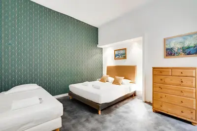 Un ou plusieurs lits dans un hébergement de l'établissement Chic apartment - 2BR-6P - Boulevard Saint-Germain