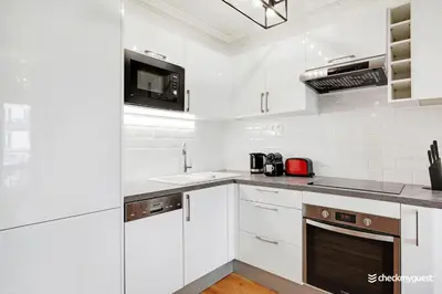 Cuisine ou kitchenette dans l'établissement Splendid apartment - 2BR-6P - Place des Vosges