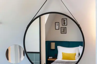 Un ou plusieurs lits dans un hébergement de l'établissement Hotel Le 37 Bis