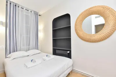 Un ou plusieurs lits dans un hébergement de l'établissement Peaceful apartment - 2BR-6P - Trocadero