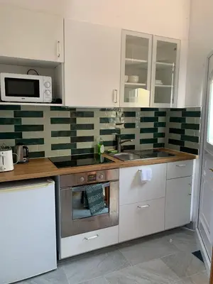 Cuisine ou kitchenette dans l'établissement PAVILLON & Jardinet A 5 MN PARIS , 30 MN STADE de FRANCE au pied du RER B