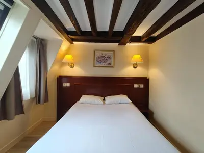 Un ou plusieurs lits dans un hébergement de l'établissement Hotel Havane Opera
