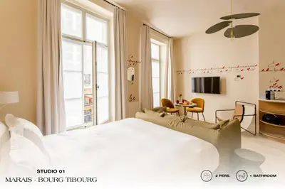 Un ou plusieurs lits dans un hébergement de l'établissement Beauquartier - Marais Bourg Tibourg