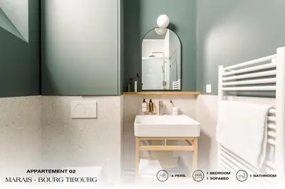 Un ou plusieurs lits dans un hébergement de l'établissement Beauquartier - Marais Bourg Tibourg