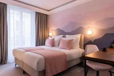 Un ou plusieurs lits dans un hébergement de l'établissement Hôtel Le Milie Rose