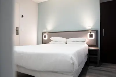 Un ou plusieurs lits dans un hébergement de l'établissement Aero Hotel