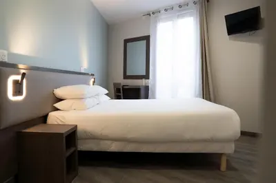 Un ou plusieurs lits dans un hébergement de l'établissement Aero Hotel