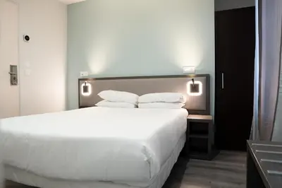 Un ou plusieurs lits dans un hébergement de l'établissement Aero Hotel