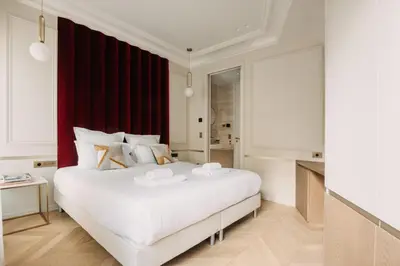 Un ou plusieurs lits dans un hébergement de l'établissement HIGHSTAY - Luxury Serviced Apartments - Champs-Elysées
