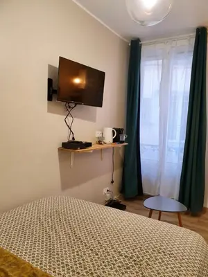 Télévision ou salle de divertissement dans l'établissement Home Sweet Home Sacré-Coeur Montmartre