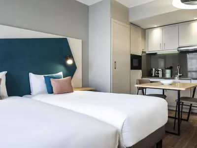 Cuisine ou kitchenette dans l'établissement Aparthotel Adagio Paris Suresnes Longchamp