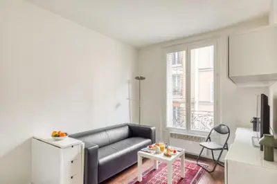 Coin salon dans l'établissement Charming Apartment close to Gare de Lyon