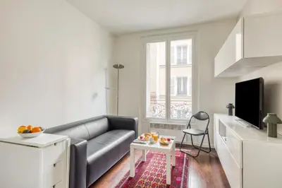 Coin salon dans l'établissement Charming Apartment close to Gare de Lyon