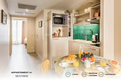 Cuisine ou kitchenette dans l'établissement Beauquartier - Sentier
