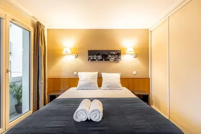 Un ou plusieurs lits dans un hébergement de l'établissement Paris Expo Apart Hotel - Porte de Versailles & Parking