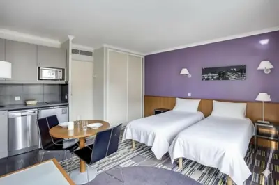 Un ou plusieurs lits dans un hébergement de l'établissement GuestReady - Studio cosy près du métro